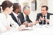 Team of a colleagues working on business plans together