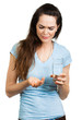 Woman in pain holding water and pill