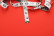 Tape Measure on red background