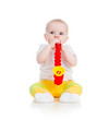 baby playing musical toy isolated