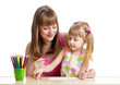 mother and her kid girl draw together