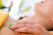 Wellness - woman having aloe vera application