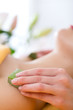Wellness - woman having aloe vera application