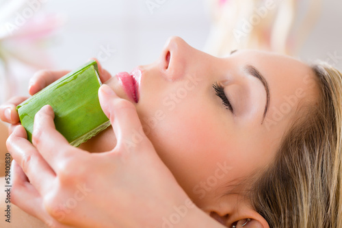 Photo: Wellness - woman having aloe vera application Wellness - woman having aloe vera application