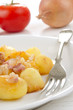 golden brown baked potato with bacon
