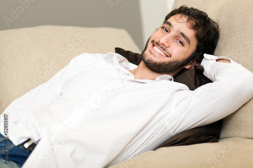 Photo: Man relaxing on the sofa Man relaxing on the sofa