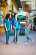 happy girls friends walking beautiful town streets