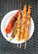 Chicken shish kebab with grilled red and green peppers.