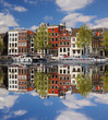Foto: Amsterdam with colorful houses against canal in Holland Amsterdam with colorful houses against canal in Holland