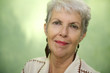 Photo: Portrait of old caucasian lady looking and smiling at camera Portrait of old caucasian lady looking and smiling at camera