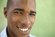 Photo: Portrait of happy young black man looking at camera and smiling Portrait of happy young black man looking at camera and smiling