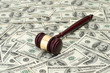 gavel on dollar background