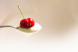 cucchiaio con yougurt e ciliegie