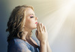 Photo: Woman holding hands in prayer Woman holding hands in prayer