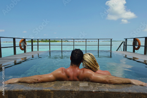 Photo: happy young couple at summer vacation have fun and relax at bea happy young couple at summer vacation have fun and relax at bea