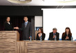 Photo: Business people at tribune in conference room Business people at tribune in conference room