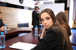 Portrait of young businesswoman in business training with her