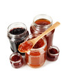 Tasty jam in banks isolated on white