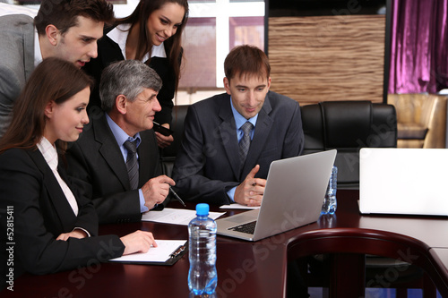Photo: Business people working in conference room Business people working in conference room