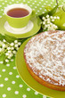 Delicious poppy seed cake with cup of tea on table close-up