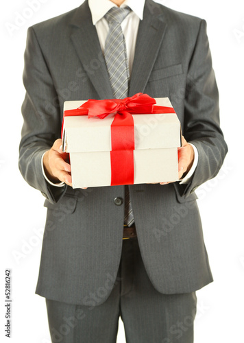 Photo: Young businessman present gift box, isolated on white Young businessman present gift box, isolated on white