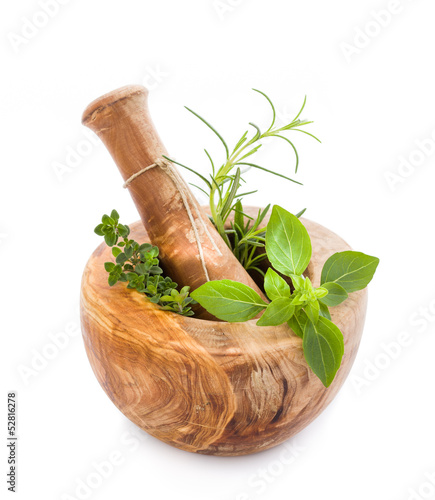 Photo: Mortar and pestle with fresh herbs Mortar and pestle with fresh herbs