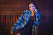 Foto: Mixed Race Young Adult Woman Portrait Sitting on Wood Bench Mixed Race Young Adult Woman Portrait Sitting on Wood Bench