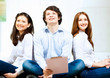 Three students smiling