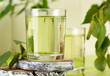 Glasses of birch sap on green wooden table