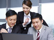 Photo: asian business team working together in office asian business team working together in office