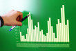 Image of hand pointing on a graph data