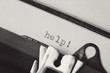 Help written on old typewriter.