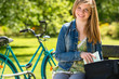 Nice student girl sitting in the park