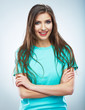 Casual style young woman posing on isolated studio background.