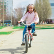 little girl with her bicycle