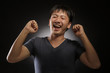 laughing young asian man portrait