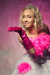 Photo: Lovely woman in bridal dress showing something with the hand Lovely woman in bridal dress showing something with the hand