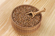 Flax seeds in wooden bowl