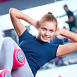 Woman at the gym exercising