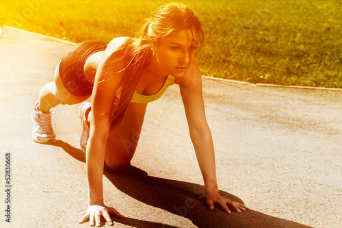 Photo: Beautiful young woman ready to run Beautiful young woman ready to run