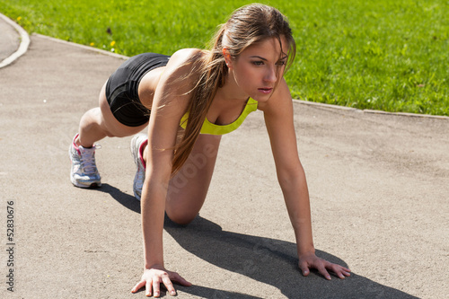Photo: Beautiful young woman ready to run Beautiful young woman ready to run