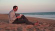 Video: Businessman working with documents on the beach Businessman working with documents on the beach