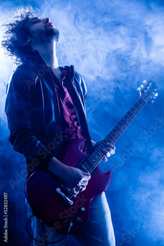 Photo: Young Man Playing Electric Guitar Young Man Playing Electric Guitar