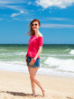 Redhead teen girl on the beach