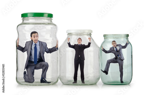 Photo: Young businessman in glass jar Young businessman in glass jar
