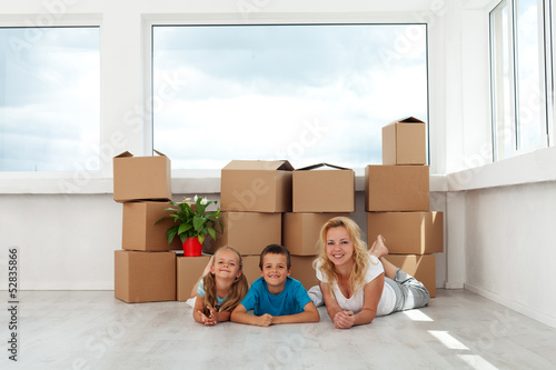 Photo: Happy woman and kids in their new home Happy woman and kids in their new home