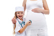 Photo: Pregnant woman expecting the baby with her child Pregnant woman expecting the baby with her child