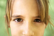 Portrait of serious young girl staring at camera