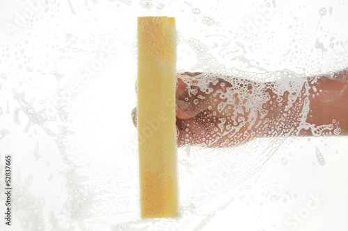 Photo: Window cleaner using a sponge Window cleaner using a sponge