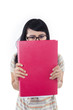 Asian female student hide behind red folder - isolated
